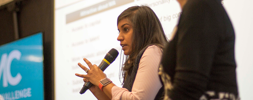 Woman speaking in a microphone